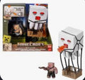 A Minecraft Movie Ghast figure with sound feature and Piglin figure set by Mattel